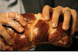 In Joshua Aaron's video Shabbat Shalom, a family breaks bread.